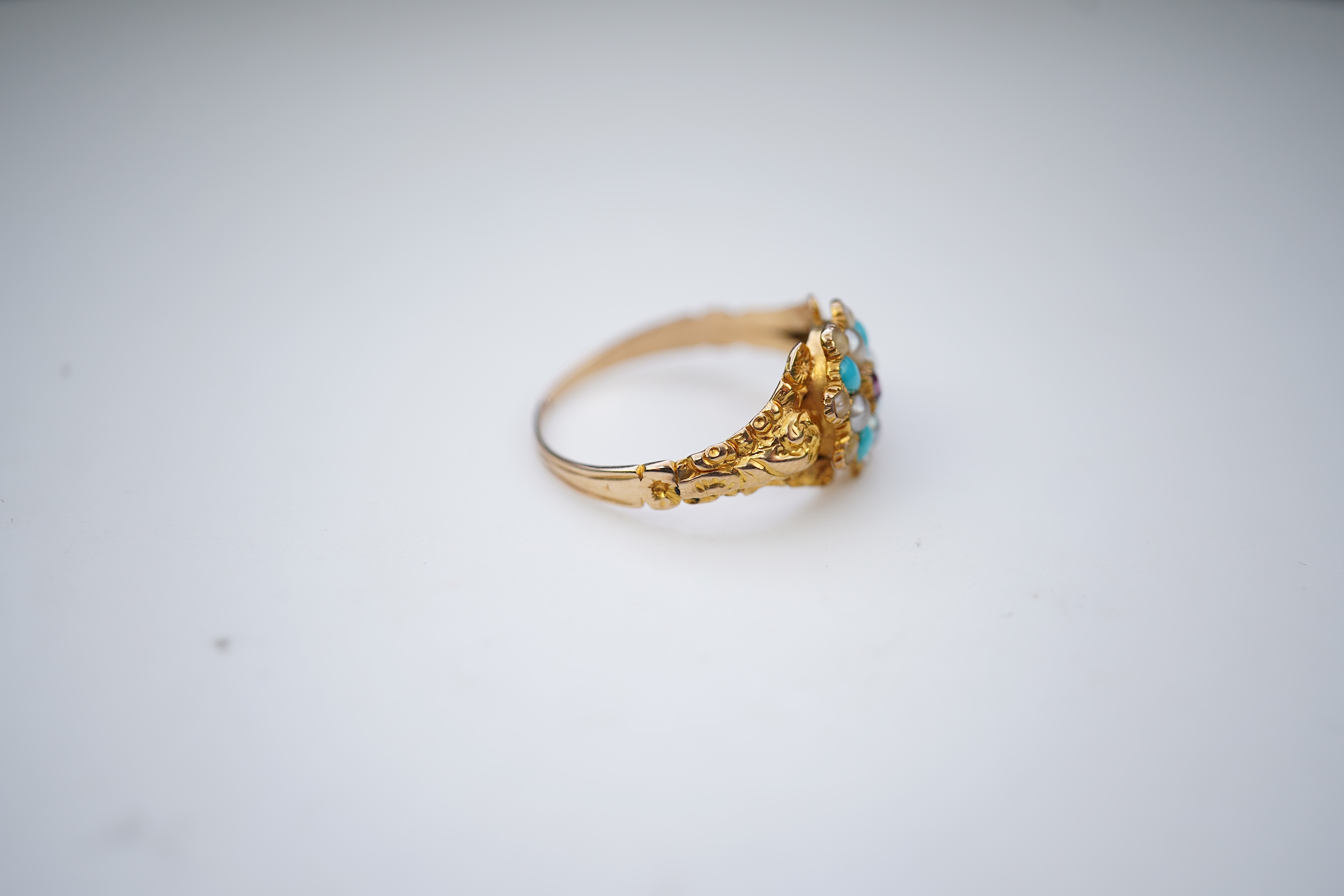 A late Georgian garnet, pearl and turquoise ring, circa 1830